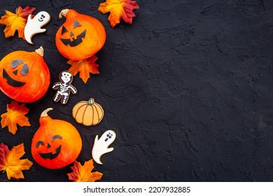 Frame Of Orange Halloween Pumpkins And Funny Cookies, Top View