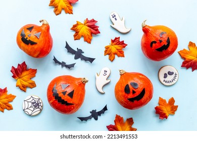 Frame Of Orange Halloween Pumpkins And Funny Cookies, Top View