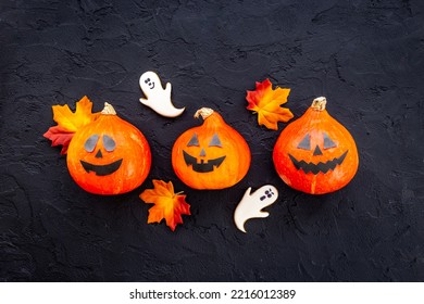 Frame Of Orange Halloween Pumpkins And Funny Cookies, Top View