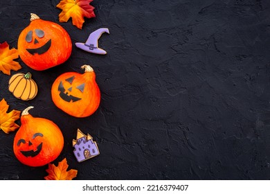 Frame Of Orange Halloween Pumpkins And Funny Cookies, Top View