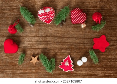 frame out of Christmas decoration, rustic and traditional in red white and green on a wooden background, - Powered by Shutterstock