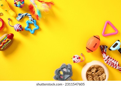 Frame of pet toys on a yellow background. Flat lay, top view. - Shutterstock ID 2311547605