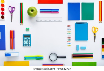 Frame with school supplies on a white background. Flat lay, top view