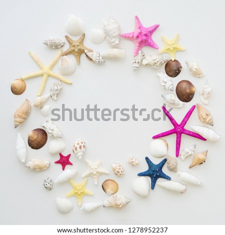 Frame from sea cockleshells and the stars. Round frame of sea shells. Copy space. Travel background.