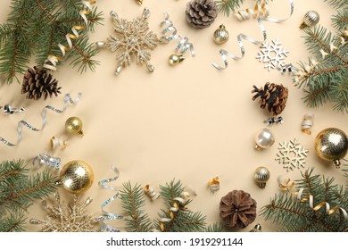 Frame of serpentine streamers and Christmas decor on beige background, flat lay. Space for text - Powered by Shutterstock