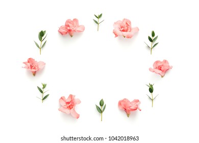 Frame With Soft Pink Azalea Flowers And Green Leaves On White Background. View From Above. Copy Space.
