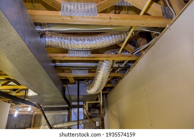 Framed home installation of air conditioner and heating ductwork in ceiling a new home HVAC