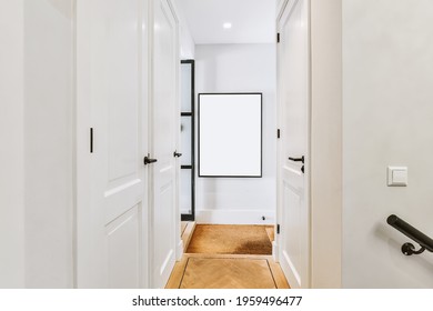 Framed Portrait Of Princess Diana And Prince Charles Hanging On Wall In Narrow Hallway In House