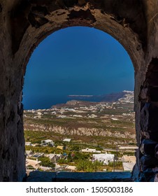 A Framed View From The Castle In Pyrgos, Santorini In Summertime