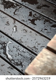 Framed Wooden surface covered with patterned raindrops