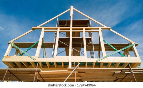 Framing Of A New Wooden House Under Construction