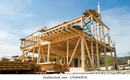 Framing Of A New Wooden House Under Construction