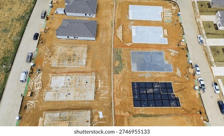 Framing and prep lots, construction activity at Highpointe Ranch, US-377, Blackjack Rd includes framed homes, early stage foundation. Timber outline, concrete pads, soil, layered site, Aubrey, TX. USA