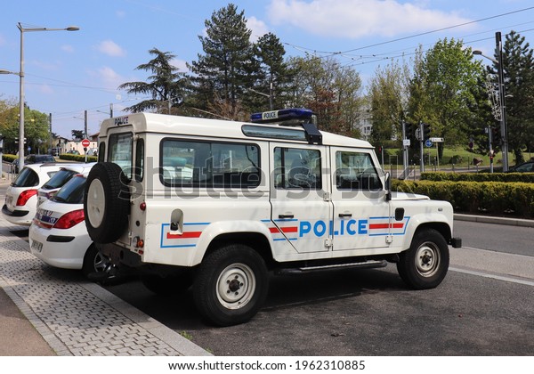 Vénissieux, France - 04 17 2021 : 4x4\
off-road police car, Land Rover Defender, in front of the police\
station, town of Vénissieux, Rhône department,\
France