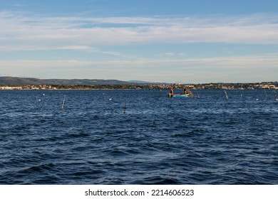 Sète, France - 10 02 2022 : Small Boat Of Fishermen On The Etang De Thau In The Early Morning