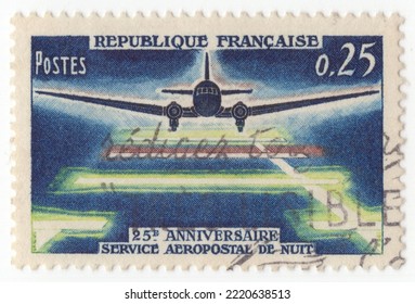 FRANCE - 1964 May 9: An 25 Centimes Multicolored Postage Stamp Depicting Plane Landing At Night. 25th Anniversary, Night Airmail Service