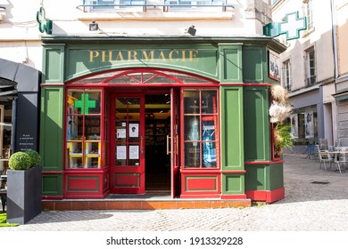 France, Bretagne - July 2020: Green and red pharmacy facade in France