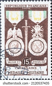 France - Circa 1952: A Postage Stamp From France , Showing A Historical Military Medal 1852-1952: Discipline And Valor 