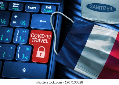 France COVID-19 Coronavirus Travel Restrictions Concept Showing Red Button Warning On Keyboard With French Flag Face Mask And Hand Sanitizer. New Normal In Global Travel.