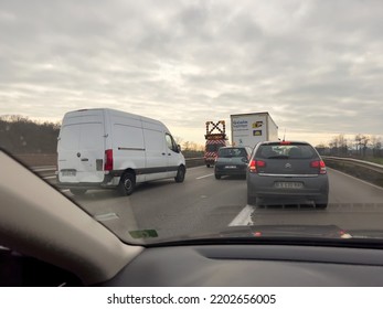 France - Dec 20, 2021: POV Drive View At The Front Driving Cars Vans And Truck - Accident Emergency Van With Large Light On The Autoroute French Highway