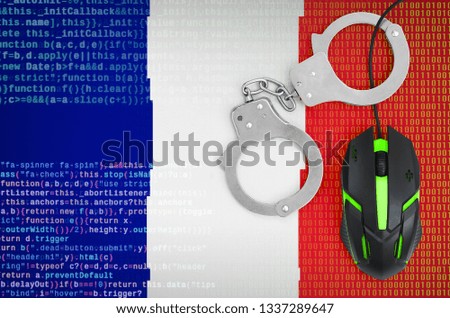 France flag  and handcuffed computer mouse. Combating computer crime, hackers and piracy