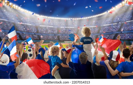 France football supporter on stadium. French fan group on soccer pitch watching winner team play. Crowd with national flag and jersey cheering for France win. Championship game - Shutterstock ID 2207014313