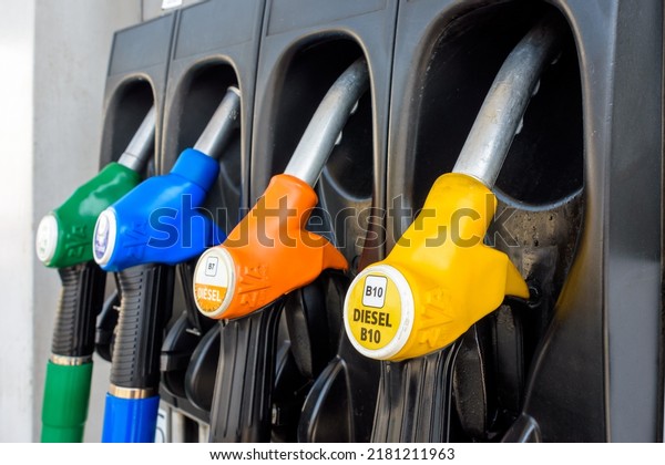 France - June 19, 2022: Close-up view of a four\
nozzle fuel pump at a gas station dispensing B10 Diesel (yellow),\
B7 Diesel (orange), E85 \