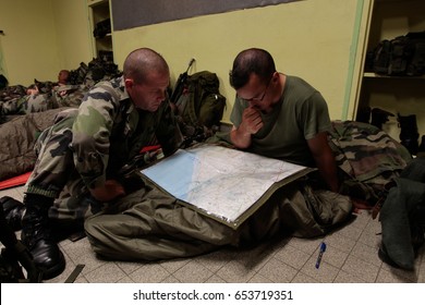 France, Normandy, June 6, 2011 - Army soldiers plot the route on the map before the start of tactical exercises in Normandy.