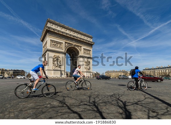 FRANCE, PARIS - APRIL 14\
: Unidentified travelers visit The Arc de Triomphe April 14, 2013\
in Paris, France. The Arc de Triomphe is one of the most famous\
monuments in Paris.