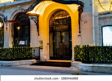 France, Paris - December 20 2020: Plaza Athenee Luxurious Hotel With Christmas Lights On Avenue Montaigne At Dusk