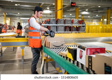 Vélizy, FRANCE Sept. 23th 2019 : 
Logistics activity on the Amazon site of Vélizy-Villacoublay in France. Packages are sorted by workers on coneyors.