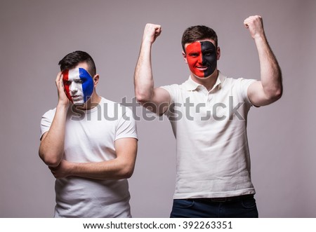 France vs Albania on grey background. Football fans of national teams demonstrate emotion: France lose, Albania win. European 2016 football fans concept.