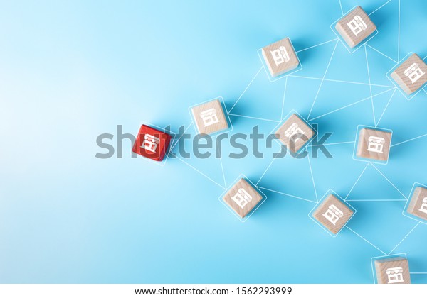 Franchise Business concept, Wooden block with\
franchise icon on blue\
background