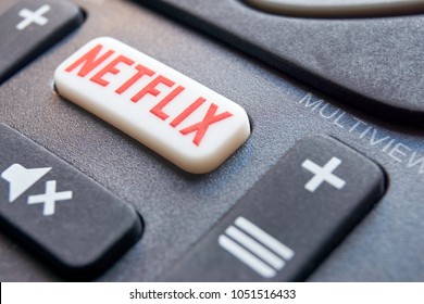 FRANEKER / THE NETHERLANDS - March 17 2018: Detail of remote control with a Netflix button. Netflix is an American company specializes in and provides streaming media and video on demand online.