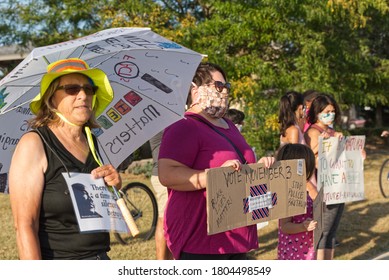 Frankfort, Illinois / USA - Aug. 27, 2020: Protesters And Counter Protesters Of The Black Lives Movement Gather On Opposite Sides Of The Street Holding Signs And Flags.