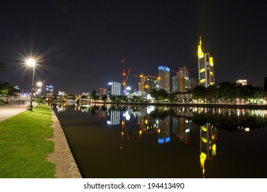 Frankfurt City Skyline And The Main River At Night