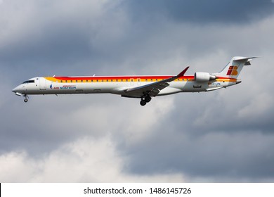 FRANKFURT / GERMANY - AUGUST 12, 2014: Iberia Regional Air Nostrum Bombardier CRJ-1000 EC-LPN passenger plane landing at Frankfurt airport