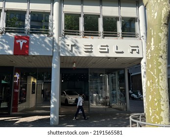 Frankfurt, Germany, August 15, 2022: Tesla Motors Corporation Fortune 500 High-tech American Electric Vehicle Company Flagship Dealership Store With Logo.