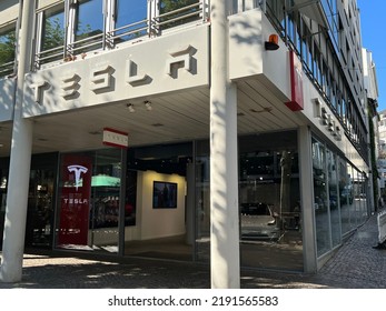 Frankfurt, Germany, August 15, 2022: Tesla Motors Corporation Fortune 500 High-tech American Electric Vehicle Company Flagship Dealership Store With Logo.