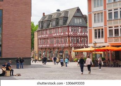 Frankfurt, Germany - June 22, 2018: Tourist Walking And Street Artists Playing Guitar And Singing In Römerberg (old Town). Half-timbered House In The Background