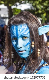 FRANKFURT, GERMANY - OCTOBER 10: Public Day At Frankfurt International Book Fair, Colorful Girl Made Up As Avatar From The Film Scene  Poses For Photographers On October 10, 2010 In Frankfurt, Germany.