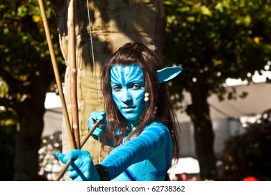 FRANKFURT, GERMANY - OCTOBER 10: Public Day At Frankfurt International Book Fair, Colorful Girl Made Up As Avatar Figure From The Film Scene And Poses On October 10, 2010 In Frankfurt, Germany.