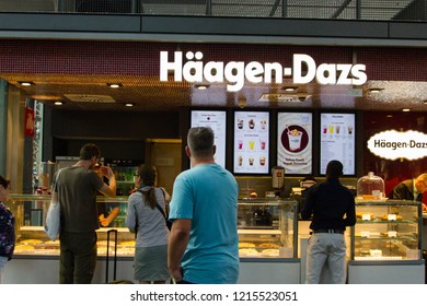 Frankfurt/ Germany - October 16 2018: Busy Haagen Dazs Ice Cream Shop With Many Customers Buying Delicious Ice Cream. Haagen-Dazs Is An American Ice Cream Brand, Sold All Over The World