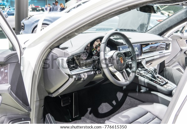 Frankfurt, Germany,\
September 13, 2017: metallic white Porsche Panamera 4 E-Hybrid at\
67th International Motor Show (IAA), control board, steering wheel,\
upholstery, seats, 