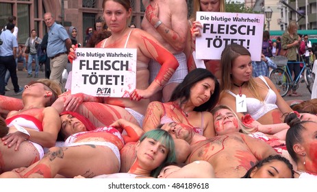 FRANKFURT, GERMANY - SEPTEMBER 16:PETA (People for the Ethical Treatment of Animals) demonstrating against animal cruelty with signs "Flesh Kills" in downtown Frankfurt, Germany on September 16, 2016.