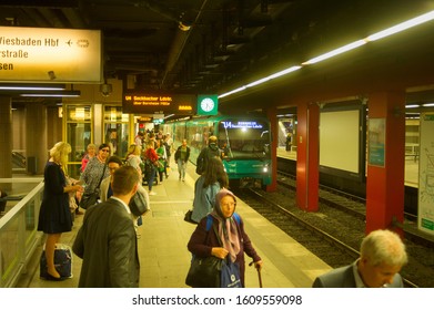 FRANKFURT AM MAIN, GERMANY - AUGUST 31, 2018: Train Arriving To Crowded Subway Platform, Frankfurt, Germany 