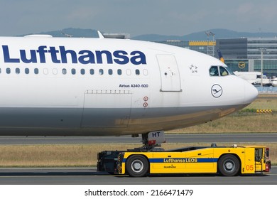 Frankfurt Am Main, Germany - June 5, 2015: Close Up View Of Lufthansa Airbus A340 Airliner With Airline Logo On Fuselage. The Airplane Is Being Towed By A Towing Tug.