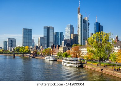 Frankfurt am Main, Germany, view of the modern financial district skyline and historical Main river riverside with cruise boats