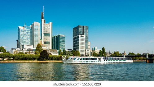 Frankfurt am Main; hesse, germany, august, 26, 2019, the skyline of the frankfurt bank district with the main bank and a cruise ship - Shutterstock ID 1516387220