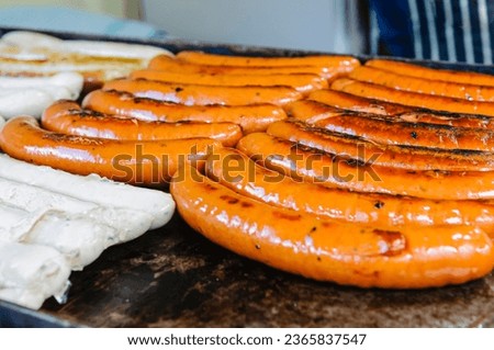 Frankfurters cooking on a market stall